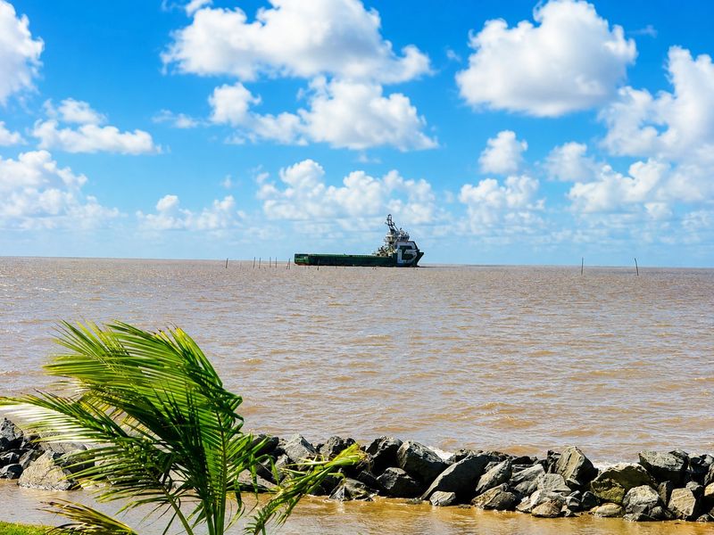 An offshore supply vessel on the Atlantic off Georgetown, seen from the seawall.